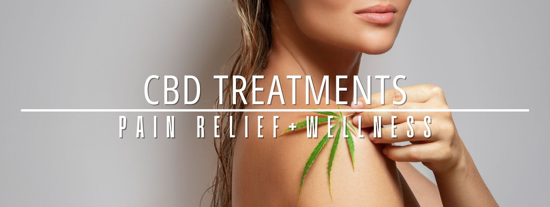 woman showing her shoulder holding leave promoting cbd treatments