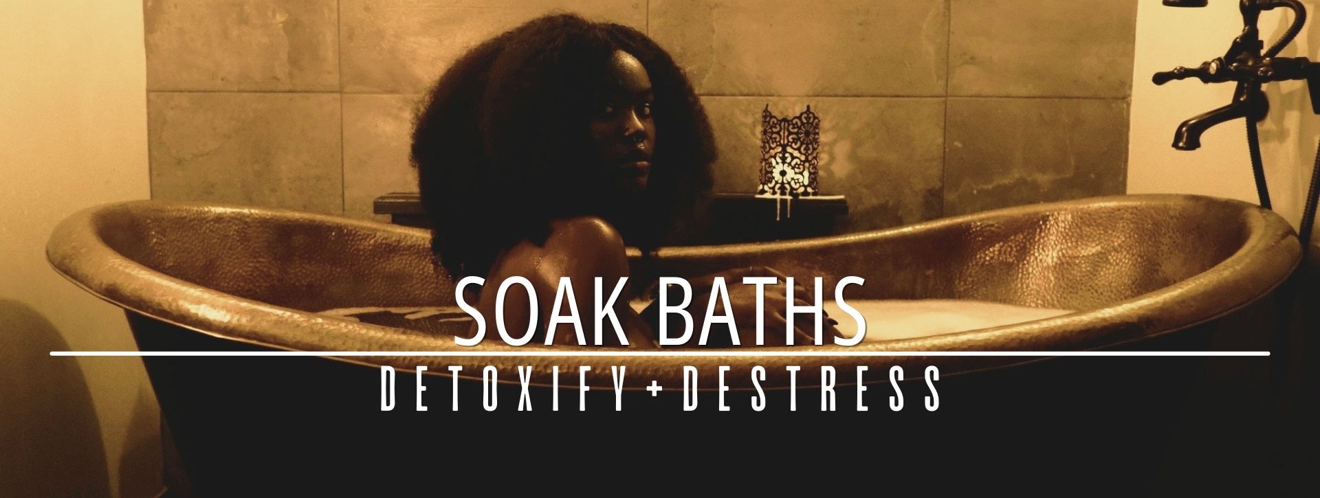 woman in a bathtub having soak baths promoting detoxify + destress
